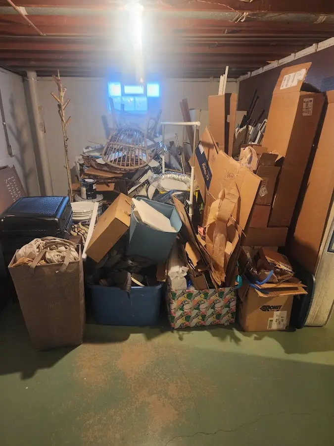 Roll-off dumpster container at job site for 2 Yard Dumpster Rental in Archbald