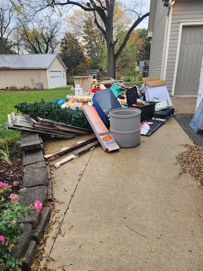 Dumpster being loaded with debris for 12 Yard Dumpster Rental in Archbald